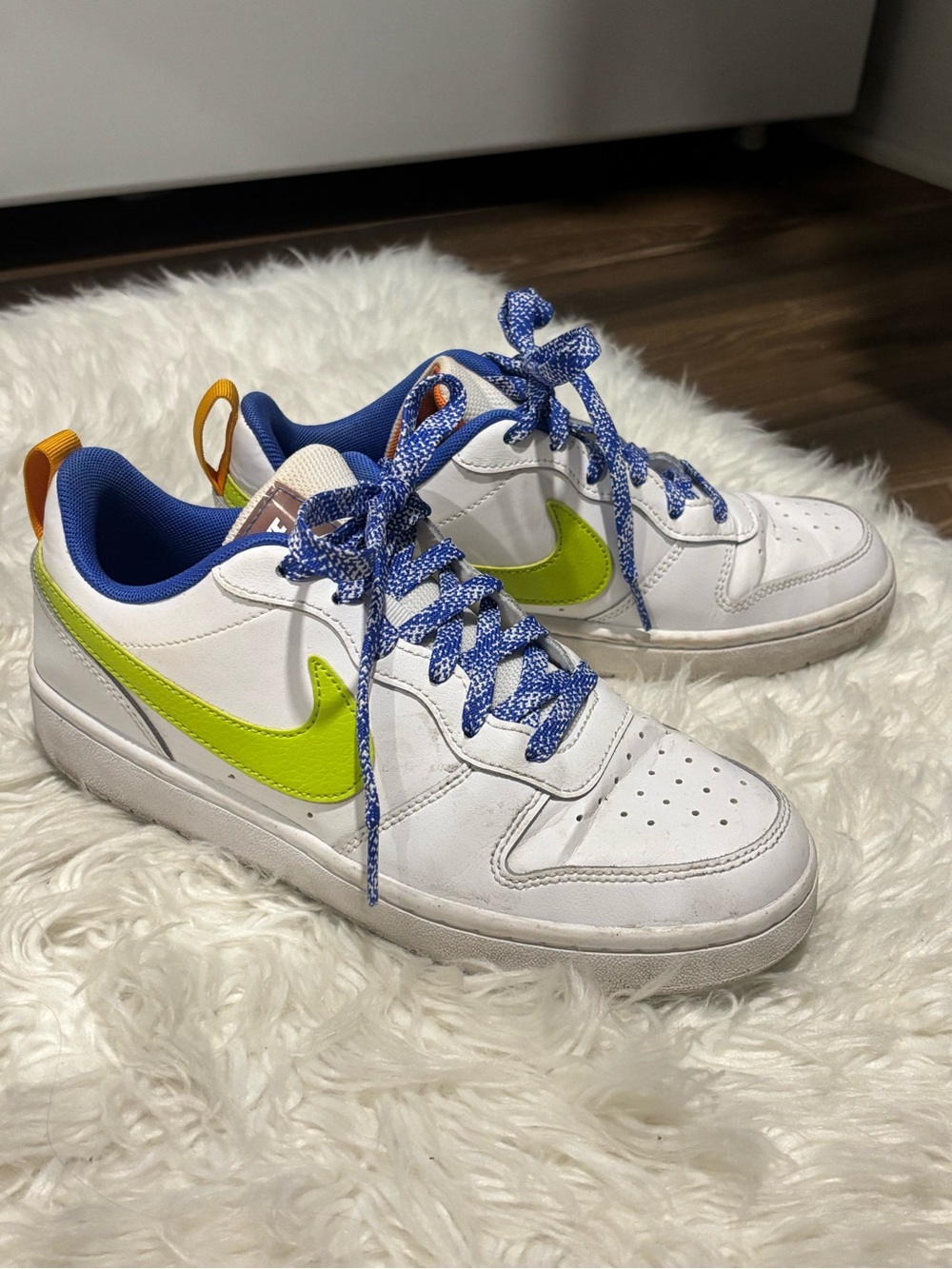 Nike White Low-Top Sneakers with Lime Swoosh and Blue Accents
